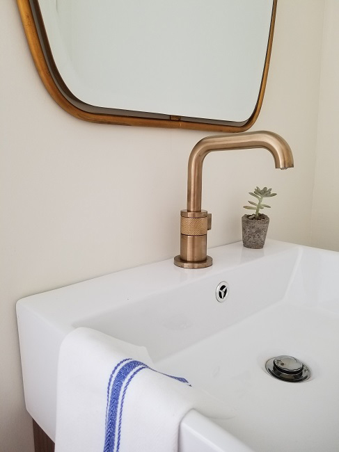 Philadelphia interior design firm Glenna Stone Interior Design bathroom trends brass faucet Brizo
