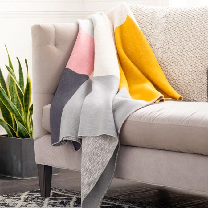 Colorblock throw blanket on sofa