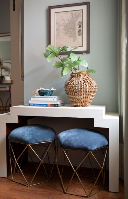 Brass and velvet stools under a console table by Glenna Stone Interior Design
