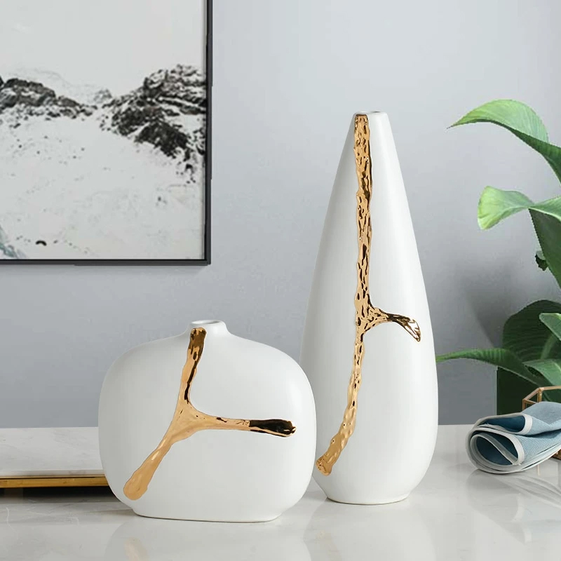 White free form vases with gold accents